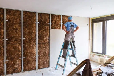 Worker-installing-drywall-hero