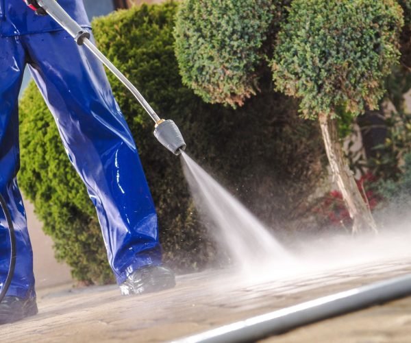 Men Washing Garden Residential Brick Paths with Professional Pressure Washer